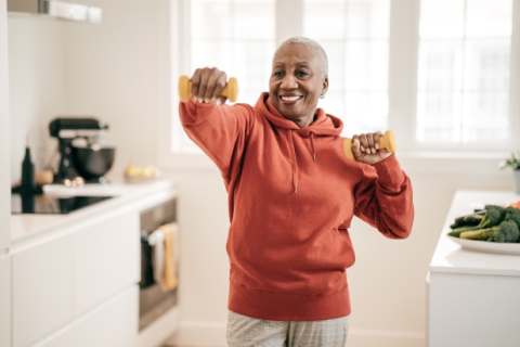 older woman with dumbbells