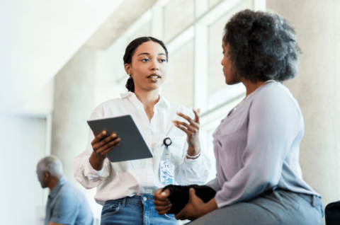 health care professional speaking with older patient