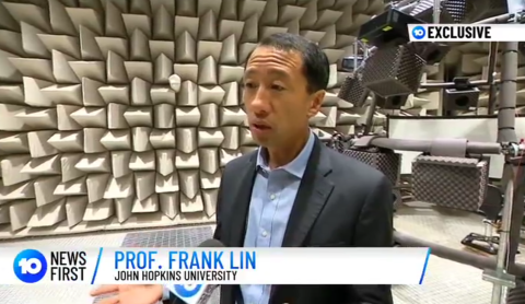 Frank Lin is interviewed by tv news in an anechoic chamber at Macquarie University